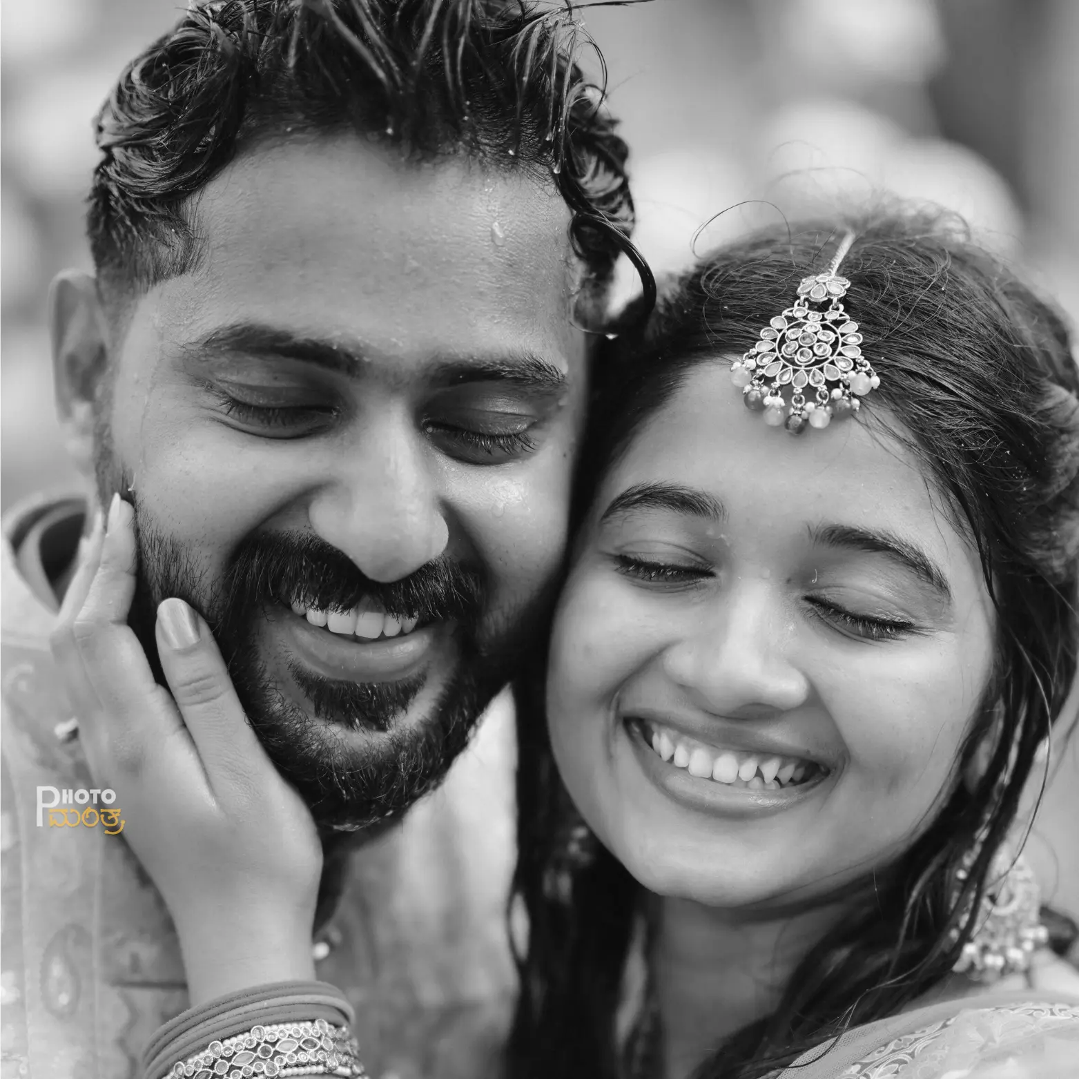Atmospheric low-angle shot of a couple taking their pheras around the sacred fire, with warm candlelight and soft-focus guests in the background.