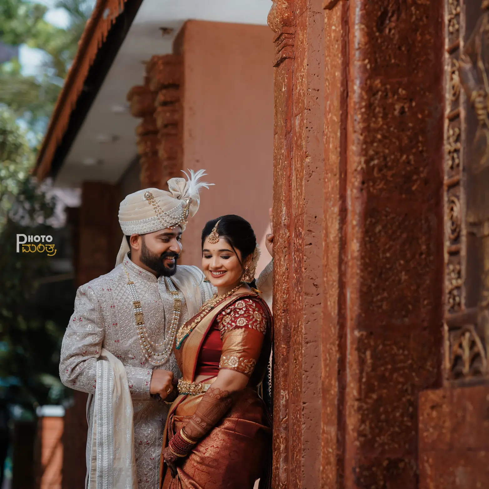 Couple walking along the Maravanthe beach shoreline during the blue hour, bathed in moody indigo tones and natural dusk light